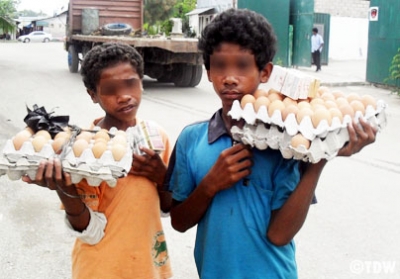 Young children working on the streets of Dili.